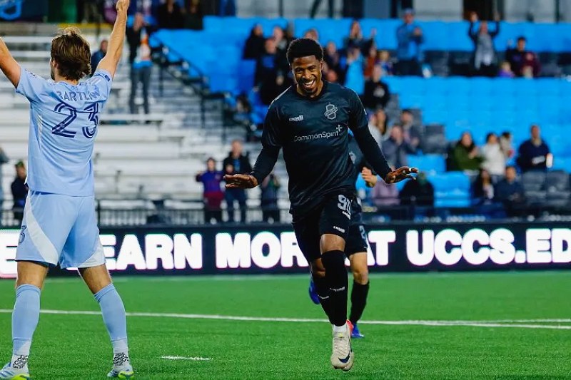 Khori Bennett, in the Switchbacks dark kit, faces the camera during a USL Championship match