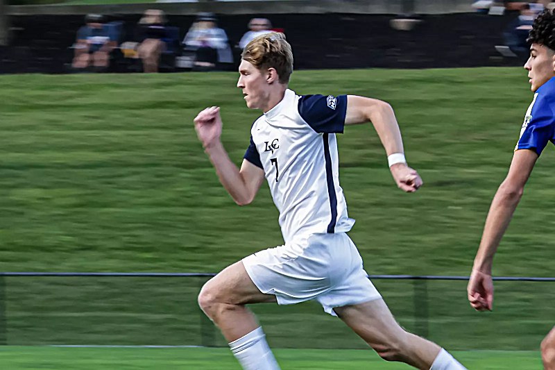 Gavin Rapp, in white No. 7, runs for Lebanon Valley College