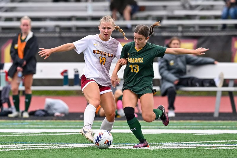 Fiona Sanders, in white No. 10, dribbles for Ursinus College