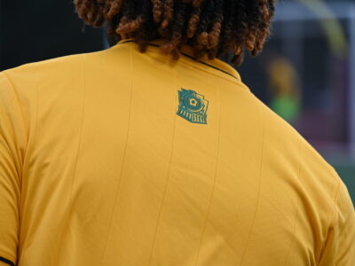 back of player yellow shirt logo back of player yellow shirt logo